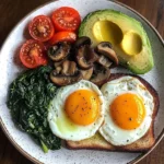 Sunny Eggs with Sauted Spinach, Mushrooms & Avocado Toast